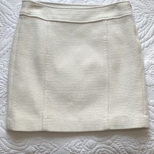 Short, winter white skirt.